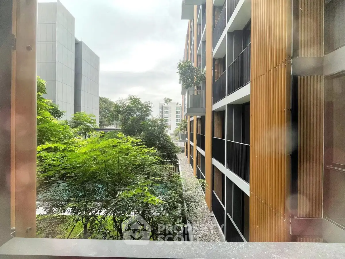 Modern apartment building with lush greenery and contemporary design