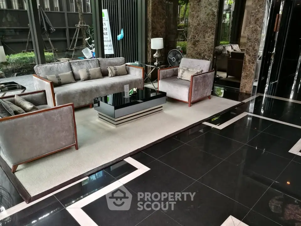 Luxurious lobby with elegant seating and marble flooring in modern building