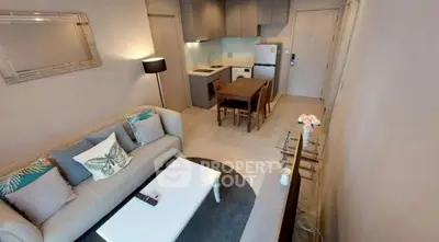 Modern open-plan living room and kitchen with stylish decor and cozy ambiance.