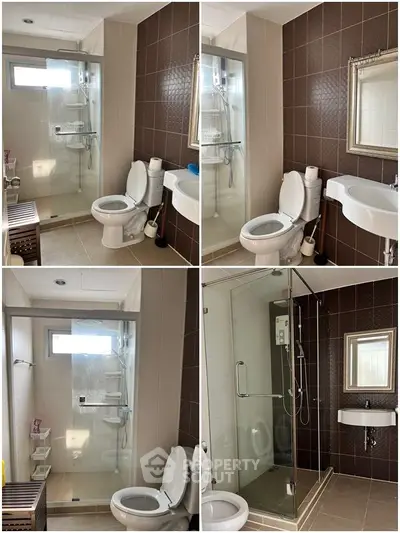 Modern bathroom with glass shower and elegant fixtures in a stylish home.