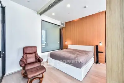 Modern bedroom with sleek design and comfortable seating