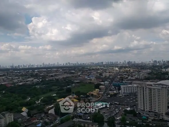 Stunning cityscape view showcasing expansive skyline under dramatic clouds.