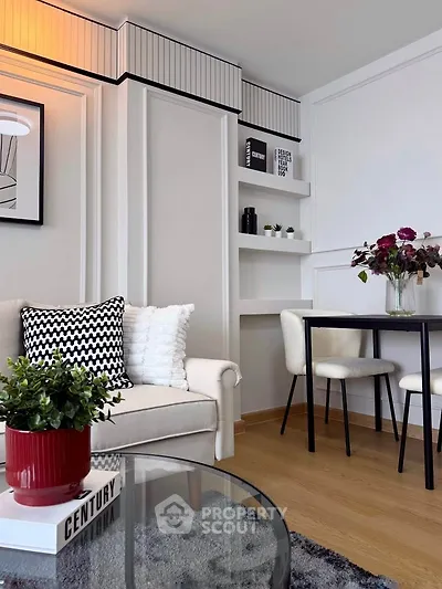 Stylish modern living room with elegant decor and cozy seating area.