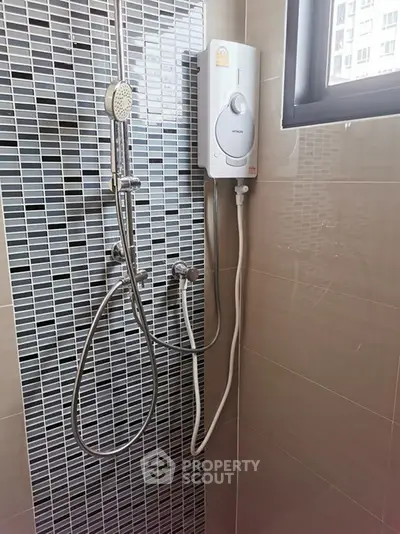 Modern bathroom shower with sleek tile design and water heater