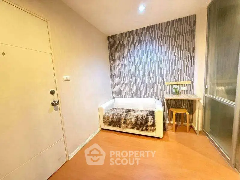 Cozy small living room with modern wallpaper and compact furniture