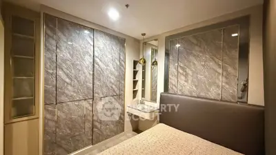 Luxurious bedroom with elegant marble accents and built-in storage