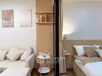 Modern studio apartment with cozy living area and stylish bedroom