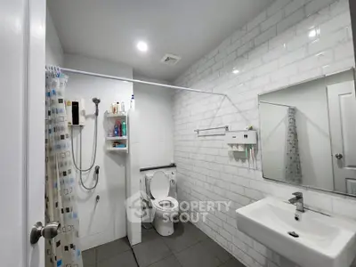 Modern bathroom with sleek fixtures and white subway tiles