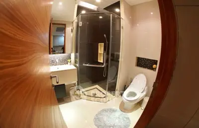 Modern bathroom with glass shower and stylish fixtures