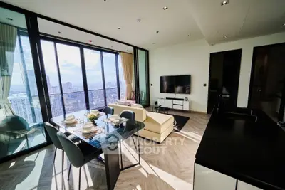 Luxurious high-rise living room with stunning city view and modern furnishings.