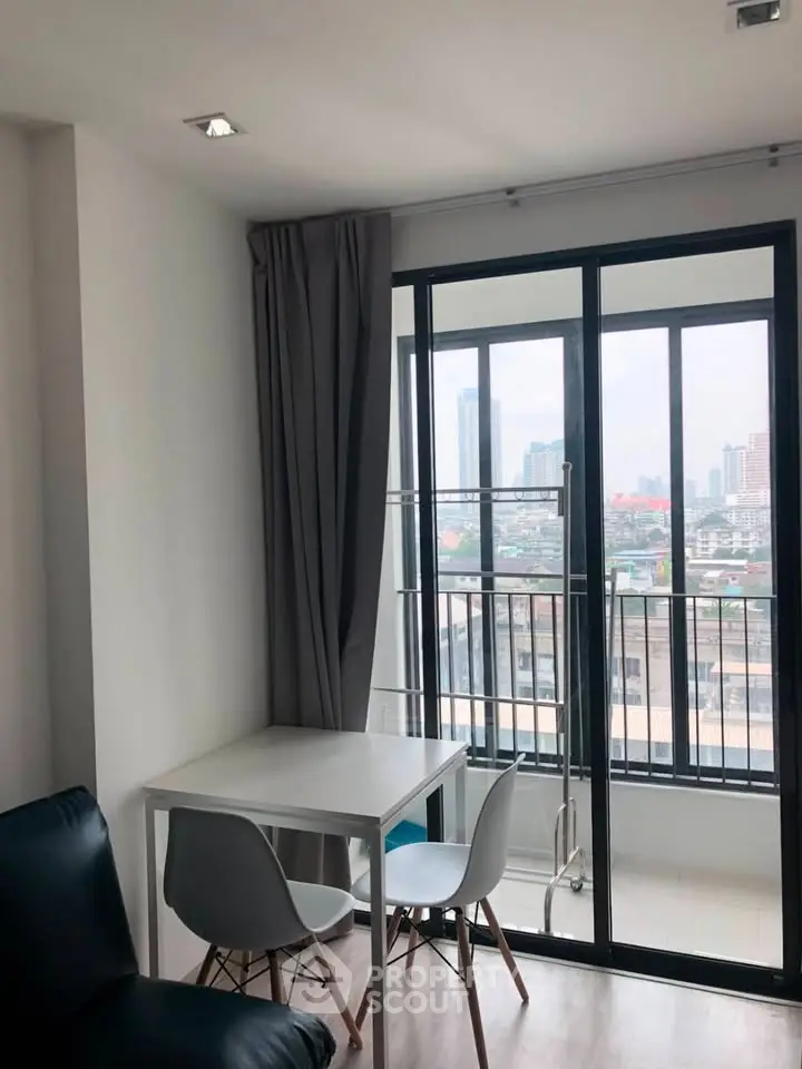 Modern apartment with balcony view and cozy dining area