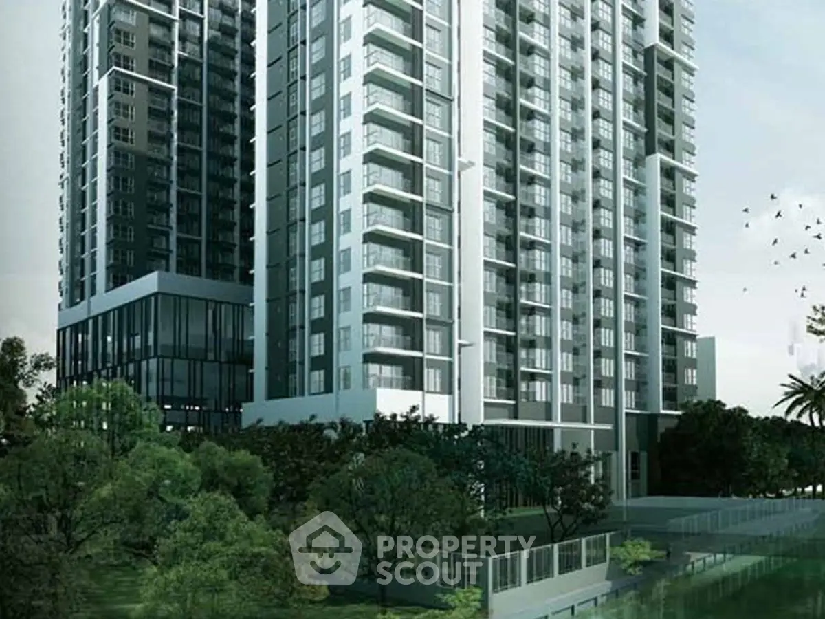 Modern high-rise residential building with lush green surroundings and contemporary design.