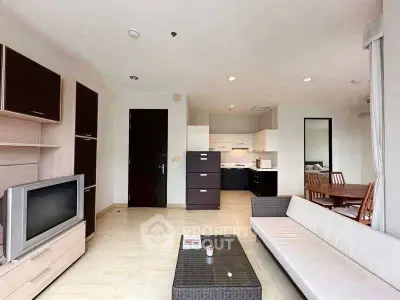 Spacious modern living room with open kitchen and stylish furniture