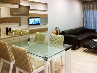 Modern living room with glass dining table and stylish decor