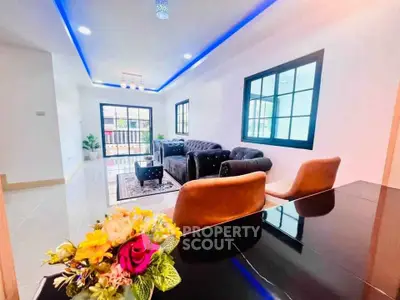 Modern living room with stylish furniture and LED ceiling lights