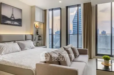 Luxurious bedroom with floor-to-ceiling windows and city skyline view.