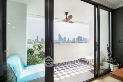 Stylish balcony with city skyline view, modern furniture, and chic decor.