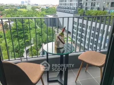 Chic urban balcony with city view, perfect for relaxing with a glass of wine.