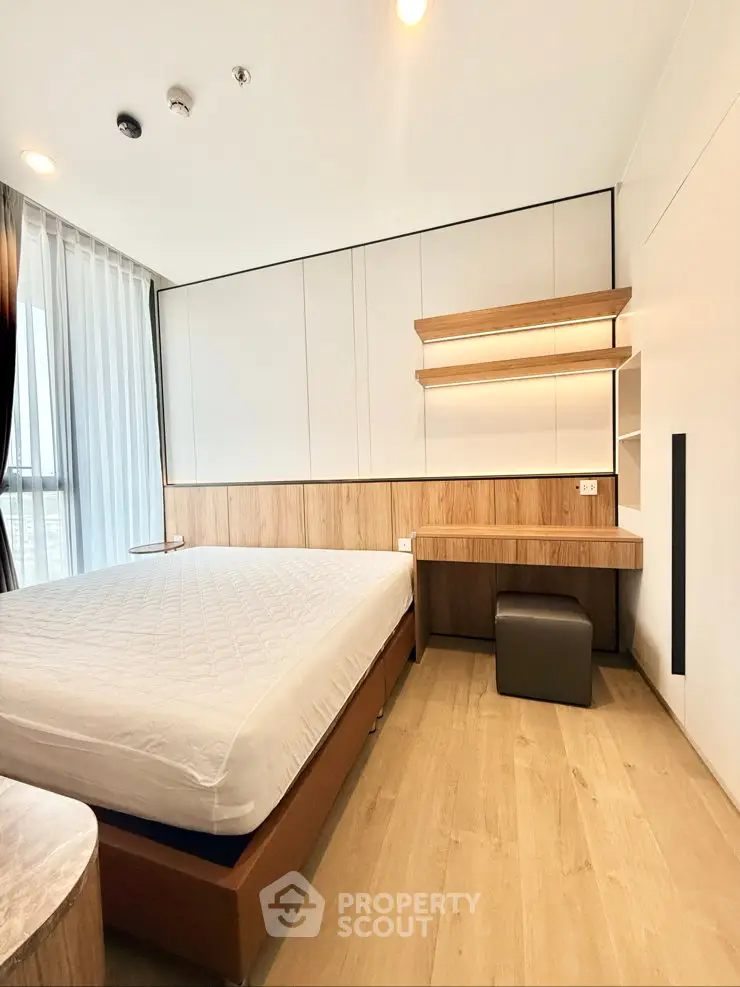 Modern bedroom with wooden accents and natural light