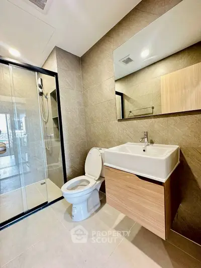 Modern bathroom with sleek design and glass shower enclosure