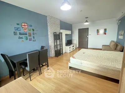 Modern studio apartment with stylish decor and wooden flooring