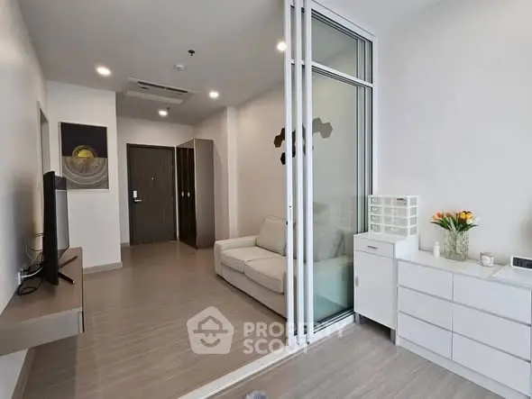 Modern living room with sleek design and sliding glass doors