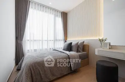 Modern bedroom with stylish decor and natural light