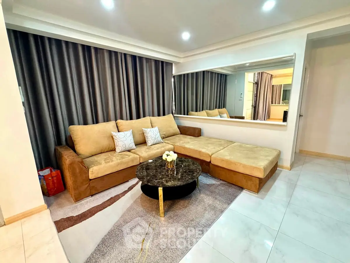 Luxurious living room with elegant sofa and modern decor, perfect for relaxation and entertaining guests.