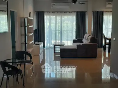 Spacious modern living room with elegant furniture and large windows