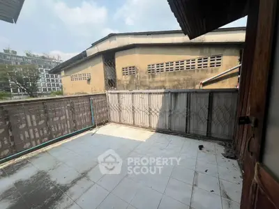 Spacious balcony with potential for renovation in urban setting