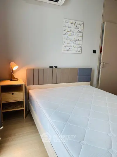 Modern bedroom with stylish bed and cozy lighting