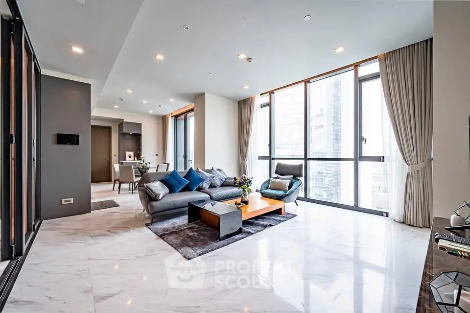 Luxurious modern living room with floor-to-ceiling windows and city view