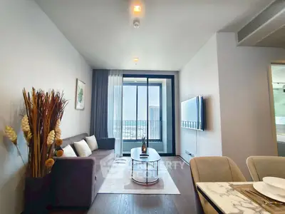 Modern living room with stylish decor and city view balcony