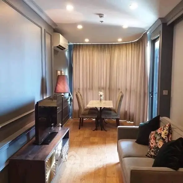 Charming living room with elegant decor and natural light, perfect for relaxation and entertainment.