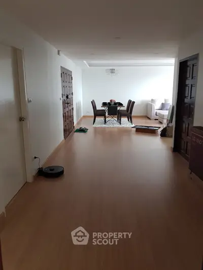 Spacious living room with dining area and modern decor