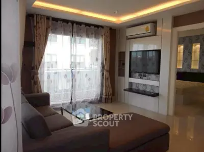 Modern living room with large sofa and stylish decor