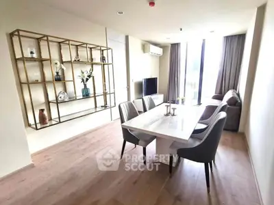 Modern living room with elegant dining area and stylish decor