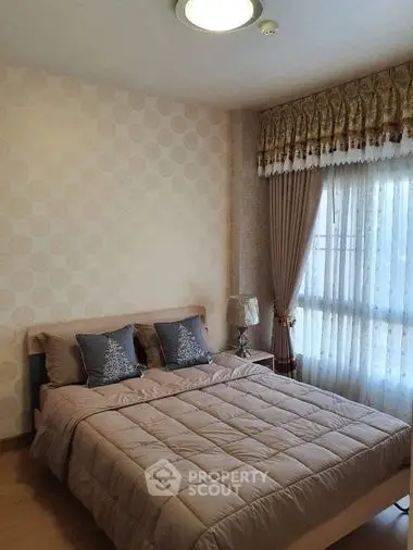 Cozy and inviting bedroom with a large comfortable bed, elegant curtains, and soft lighting, perfect for relaxation and tranquility.