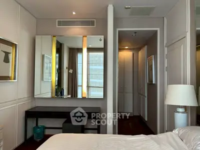 Elegant bedroom with modern decor and stylish mirror in luxury apartment