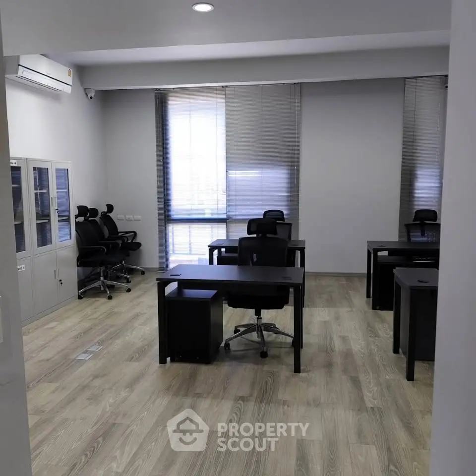 Modern office space with sleek desks and chairs, perfect for productivity.