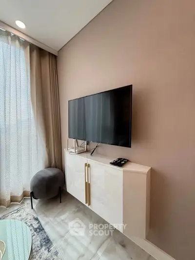 Modern living room with wall-mounted TV and elegant decor