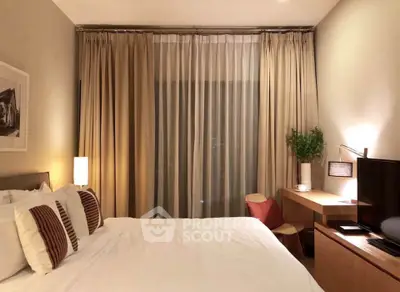 Cozy bedroom with modern decor, featuring a comfortable bed, stylish desk, and ambient lighting.