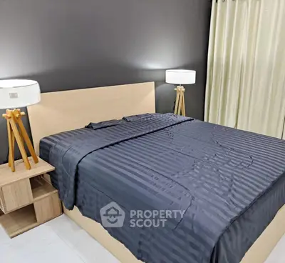 Modern bedroom with stylish lamps and elegant bedding