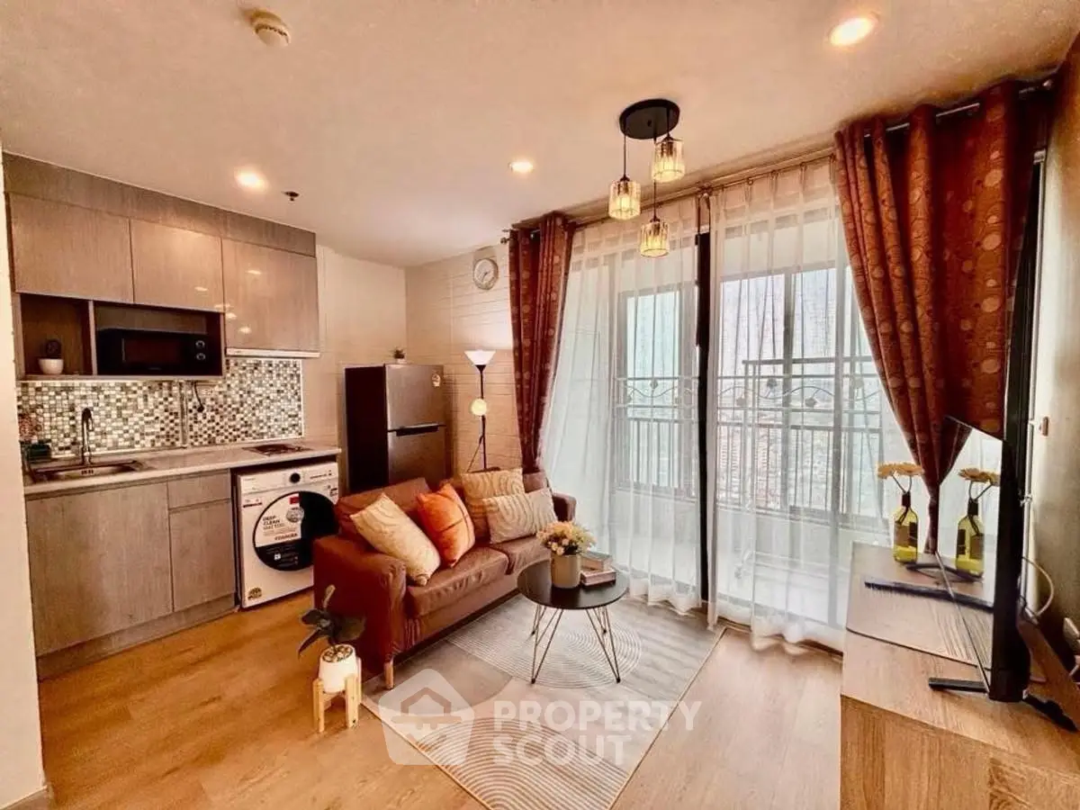 Chic modern living room with open kitchen and balcony, perfect for urban living.