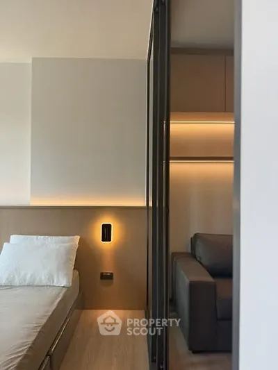 Modern bedroom with sleek design and cozy lighting