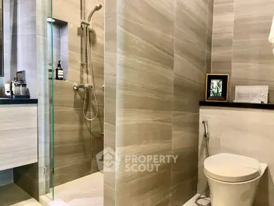 Modern bathroom with sleek shower and elegant fixtures