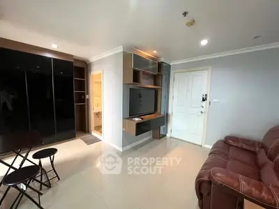 Modern living room with sleek furniture and built-in TV unit