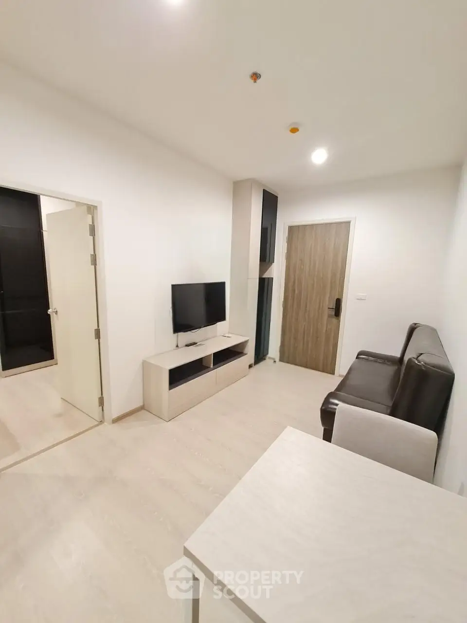 Modern living room with sleek furniture and minimalist design, perfect for urban living.