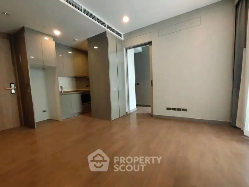 Spacious modern apartment with open layout and sleek kitchen design.