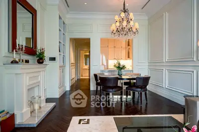 Elegant living room with chandelier and fireplace in luxury apartment